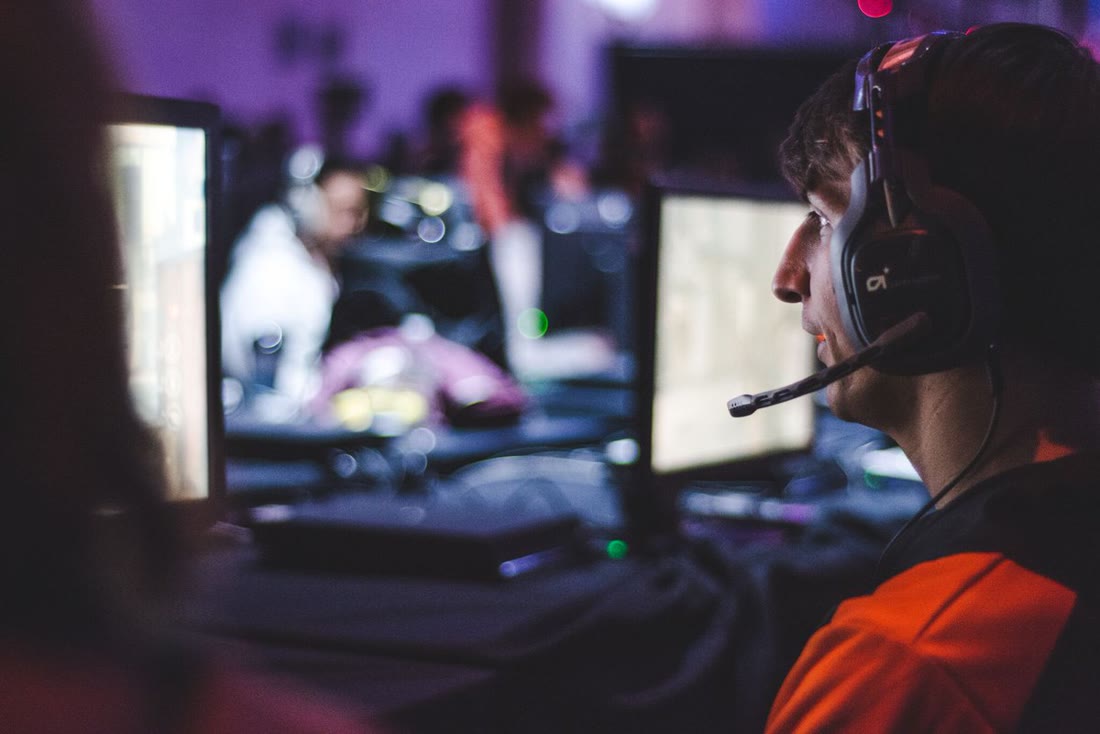 CBALL at his station in the FURY orange jersey, mid-match at a LAN