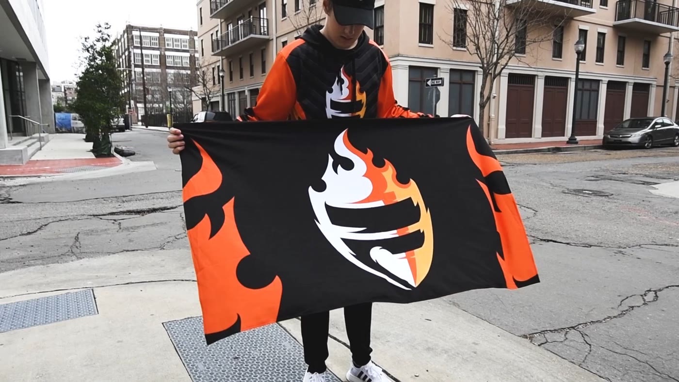 Chance Maynard, FURY Gaming co-founder and COO, holding the FURY flag